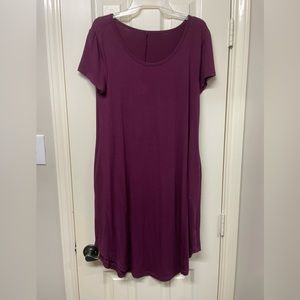 Purple short sleeve mid length dress with pockets. Size medium